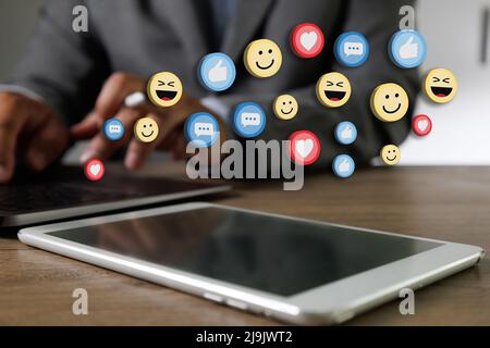 man using smart phone,Social Distancing Social media and Marketing virtual icons screen man watching a live streaming and Working From Home concept Stock Photo