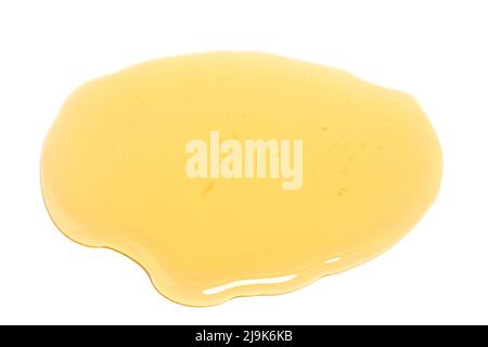 Puddle of honey isolated over white background Stock Photo - Alamy