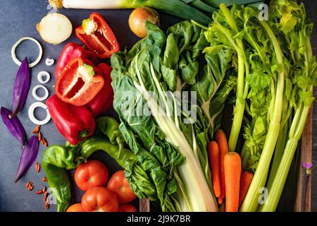 Healthy foods. Vegetables and fruits collection on black cement or stone background. Top view and copy space.Vegetarian food background. Stock Photo
