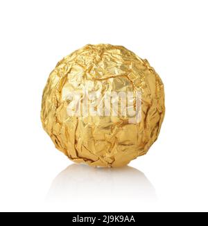 Front view of single chocolate ball candy in gold foil wrapper isolated on white Stock Photo