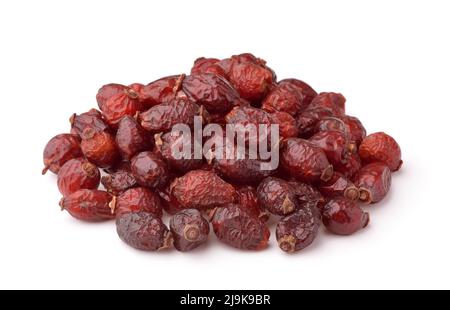 Pile of dried rose hips isolated on white Stock Photo