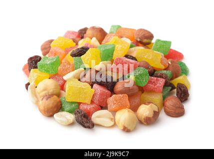 Pile of mixed dried fruit and nuts isolated on white Stock Photo