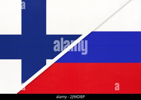 Finland and Russia, symbol of country. Finnish vs Russian national flags. Relationship and partnership between two countries. Stock Photo