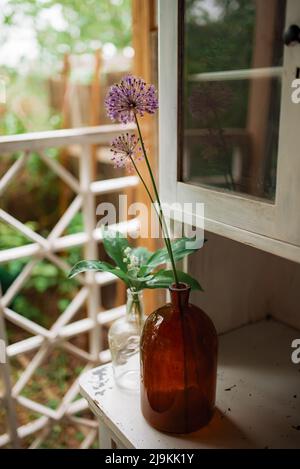 DIY old empty bottles can be used for event decoration as a flowers vases, summer time Stock Photo