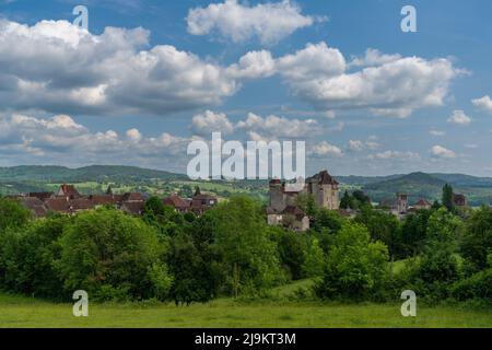 Curemonte, France - 13 May, 2022: panorama view of the idyllic French village of Curemonte and the Plas Chateau in the Dordogne Valley Stock Photo