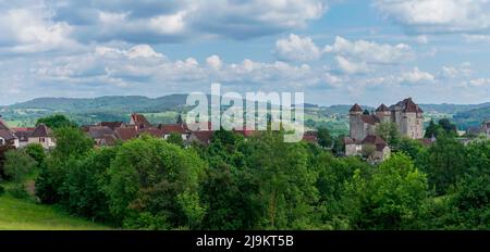 Curemonte, France - 13 May, 2022: panorama view of the idyllic French village of Curemonte and the Plas Chateau in the Dordogne Valley Stock Photo