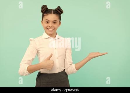 Shopping at its best. Happy child give thumbs up showing open hand. Shopping like never before Stock Photo