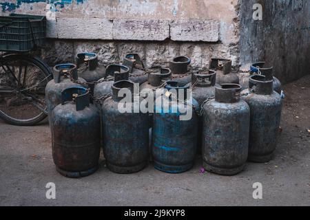 Many old, used propane gas bottles Stock Photo