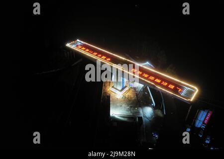 Xingye, China's Guangxi Zhuang Autonomous Region. 24th May, 2022. Aerial photo shows the girder of a swivel bridge along the Nanning-Yulin railway rotating to its targeted position in Xingye County, south China's Guangxi Zhuang Autonomous Region, May 24, 2022. The girder of this swivel bridge rotated 57 degrees on Tuesday to its targeted position. Credit: Cao Yiming/Xinhua/Alamy Live News Stock Photo