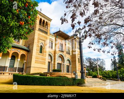 The Mudejar Pavilion designed by Anibal Gonzalez and built in 1914 houses the Museum of Arts and Popular Customs of Seville (Museo del Artes y Costumbres Populares) in Maria Luisa Park - Seville, Spain Stock Photo