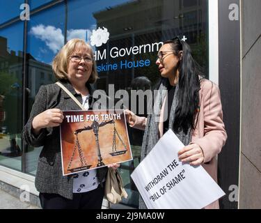 Marian Walsh (left) who's son Damien was killed in 1993 by the UFF stands with Natasha Butler granddaughter of Paddy Butler who was killed during the Springhill Westrock killings, stand together at the Northern Ireland Office UK Government Hub at Erskine House in Belfast, in protest on the UK Governments Troubles legacy bill. Picture date: Tuesday May 24, 2022. Stock Photo