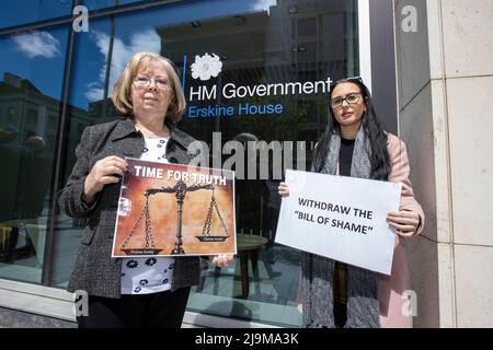 Marian Walsh (left) who's son Damien was killed in 1993 by the UFF stands with Natasha Butler granddaughter of Paddy Butler who was killed during the Springhill Westrock killings, stand together at the Northern Ireland Office UK Government Hub at Erskine House in Belfast, in protest on the UK Governments Troubles legacy bill. Picture date: Tuesday May 24, 2022. Stock Photo