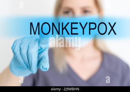 healthcare, medicine and technology concept - smiling female doctor without stethoscope pointing to something or pressing imaginary button Stock Photo