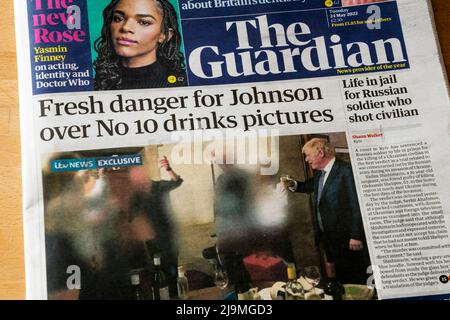 24 May 2022. Front page headline of the Guardian reads Fresh danger for Johnson over No 10 drinks pictures, after new pictures emerge of Boris Johnson & Downing Street lockdown parties. Stock Photo