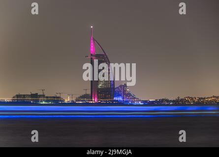 View of the illuminated Burj Al Arab, the iconic 7 star hotel in Dubai captured from the Palm Jumeirah . Stock Photo