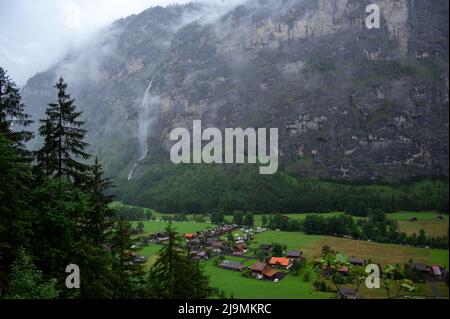 Picturesque landscape of touristic alpine village of Lauterbrunnen with beautiful waterfalls, captured from Trummelbach falls, Switzerland, Europe. Stock Photo