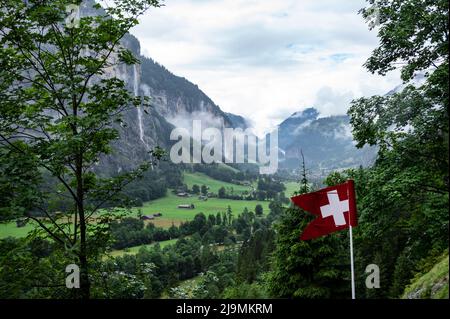 Picturesque landscape of touristic alpine village of Lauterbrunnen with beautiful waterfalls, captured from Trummelbach falls, Switzerland, Europe. Stock Photo