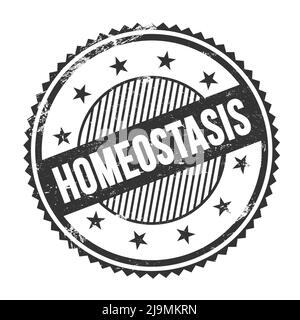 HOMEOSTASIS text written on black grungy zig zag borders round stamp. Stock Photo