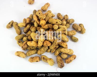 Organic peanuts in shell isolated on white background. Stock Photo
