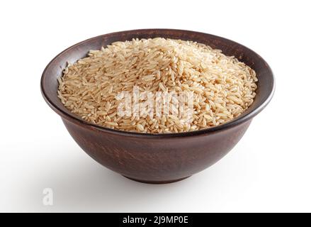 Brown rice in ceramic bowl isolated on white background with clipping path Stock Photo