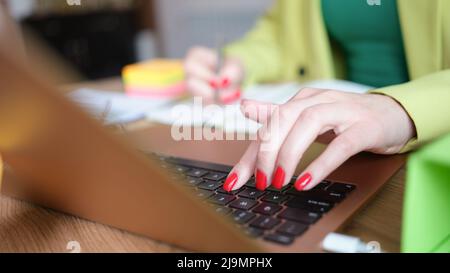 Closeup of busy woman working from home Stock Photo