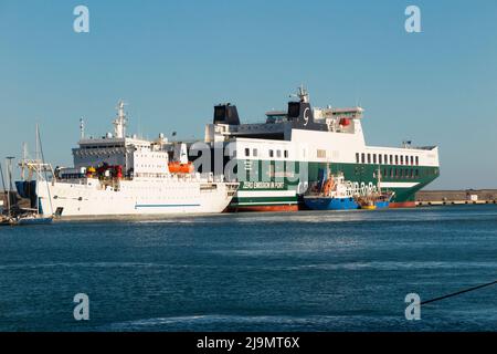 Port of Catania, Sicily, where ships (such as ECO MALTA (IMO: 9859583)  Ro-Ro Cargo / Roll-on/roll-off) green / white vessel, dock to unload. Italy. (129) Stock Photo