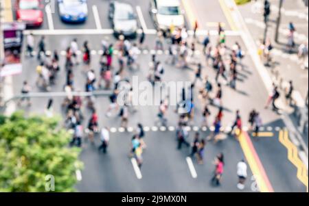 Blurred defocused abstract background of people walking on the street in Orchard Road in Singapore - Crowded city center during rush hour in urban bus Stock Photo