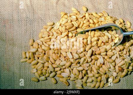A close up shot of peeled peanuts and an aluminum scoop in a farmer’s market, can be used as a background, texture or poster, Ontario, Canada - stock Stock Photo