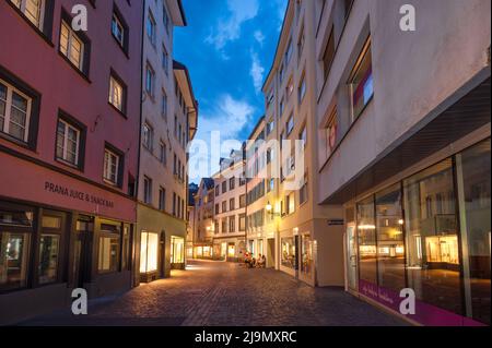 Chur, Switzerland. Picturesque view of the Chur village  with old historic buildings, alpine mountains and flowing Rhine river captured in night Stock Photo