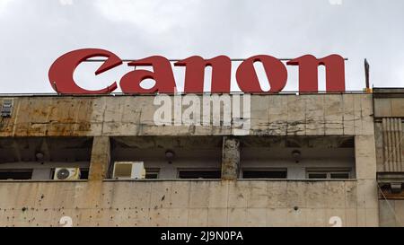 Belgrade, Serbia - August 28, 2021: Big Red Sign Canon at Top of Old Building in City. Stock Photo