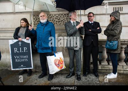 Francie Molloy and Mickey Brady, attends, the British government plan to change the law in relation to the British agent and soldier who murder Irish Catholic and Irish Republic exempt from prosecution. The victims of the families here to seeking justice curry a coffin in front of Downing street, London, UK. - 24 May 2022. Stock Photo