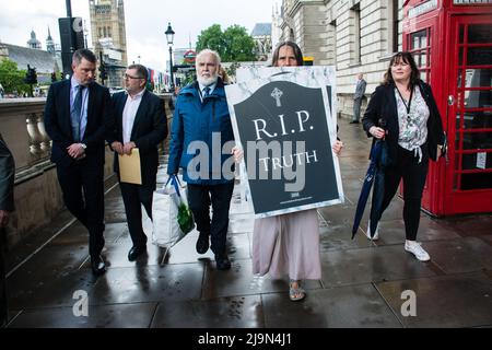 John Finucane, Francie Molloy, Michelle Gildernew attends, the British government plan to change the law in relation to the British agent and soldier who murder Irish Catholic and Irish Republic exempt from prosecution. The victims of the families here to seeking justice curry a coffin in front of Downing street, London, UK. - 24 May 2022. Stock Photo