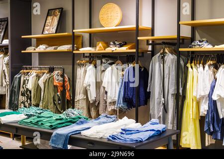 Interior of a brand new fashion clothing store. Panorama, Vilnius