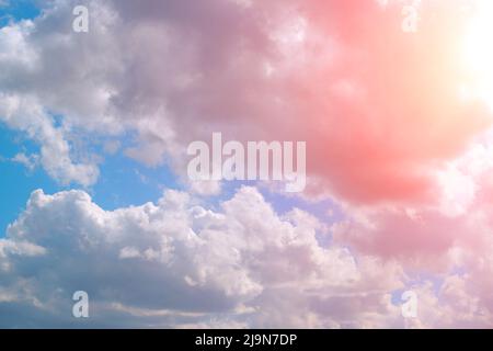 Bright pink, summer clouds against the blue sky Stock Photo