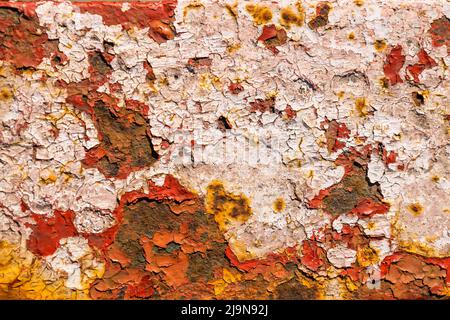 Rusty metal surface with paint flaking and cracking texture Stock Photo