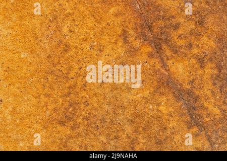 A background or texture of brown old stone slab with a crack Stock Photo