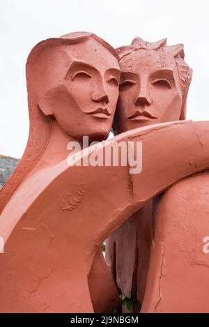 “The Lovers,” Kenneth Allen’s sculpture, of an embracing couple, in the small sculpture courtyard at Gretna Green (Scotland} nr the Blacksmith's shop. Stock Photo