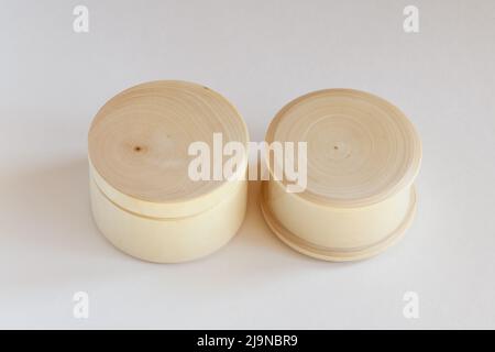 Two round wooden caskets mock up on white background Stock Photo