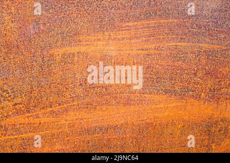 Russet colours of a rusty patterned texture on a metallic surface Stock Photo