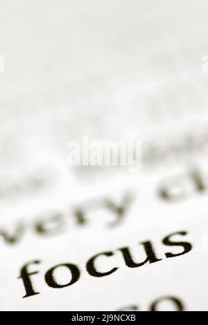 Close up of the typed word focus printed in black ink on white ink jet paper Stock Photo