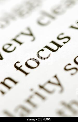 Close up of the typed word focus printed in black ink on white ink jet paper Stock Photo