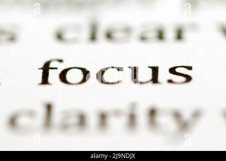 Close up of the typed word focus printed in black ink on white ink jet paper Stock Photo