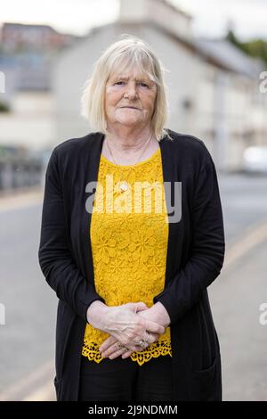 John Moran's sister Annie Clarke outside Banbridge Courthouse in Northern Ireland, where a inquest into his death is taking place. A coroner has been told he will hear evidence that an explosion which caused the death of a John Moran in Belfast 50 years ago was the result of a co-ordinated UVF attack, rather than an 'IRA own goal'. John Moran was 19 when he was seriously injured in a bomb attack at Kelly's Bar on the Springfield Road on May 13 1972, and died of his injuries 10 days later. Stock Photo