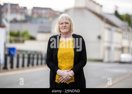 John Moran's sister Annie Clarke outside Banbridge Courthouse in Northern Ireland, where a inquest into his death is taking place. A coroner has been told he will hear evidence that an explosion which caused the death of a John Moran in Belfast 50 years ago was the result of a co-ordinated UVF attack, rather than an 'IRA own goal'. John Moran was 19 when he was seriously injured in a bomb attack at Kelly's Bar on the Springfield Road on May 13 1972, and died of his injuries 10 days later. Stock Photo