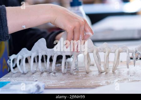 Woman molding and sculpting clay art pieces. Horizontal creative theme poster, greeting cards, headers, website and app Stock Photo