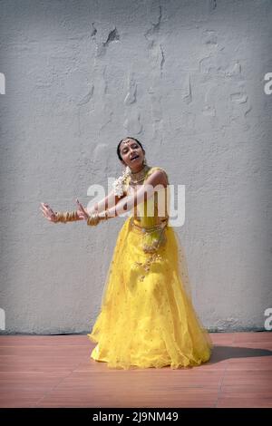 An attractive teenage dancer from the Sundaries group performs at tte Bollywood & Indian Folk Fusion Dance Concert in Charles Drew Park in Queens, NYC Stock Photo