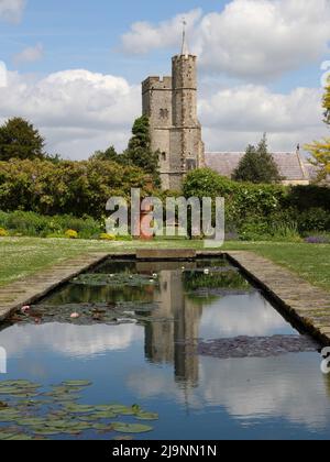 The Church of the Holy Cross viewed from the walled gardens at Goodnestone Park Stock Photo
