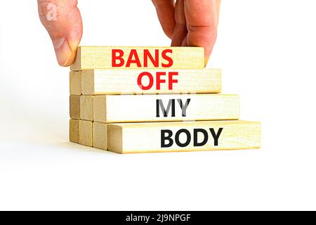Bans off my body symbol. Concept words Bans off my body on wooden blocks on a beautiful white table white background. Women rights concept. Business s Stock Photo