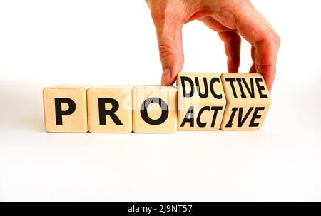 Proactive and productive symbol. Businessman turns cubes and changes the concept word Productive to Proactive. Beautiful white background. Business, p Stock Photo