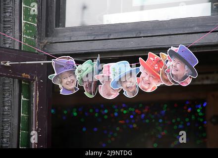 Bunting for Queen Elizabeth II's Platinum Jubilee in the Abbey Arms pub doorway, Abbey Wood, southeast London Stock Photo
